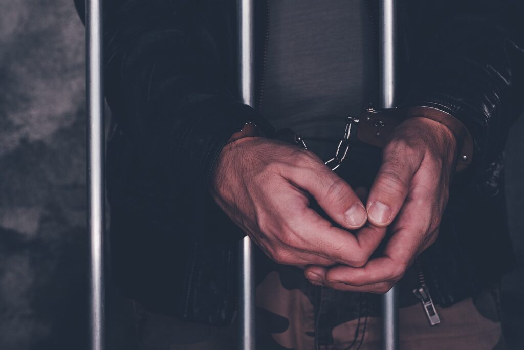 BigStock-Jail-behind-bars-11.jpg