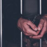 BigStock-Jail-behind-bars-11.jpg